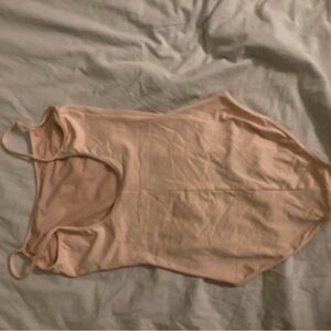 woman peach bodysuit size small,never worn